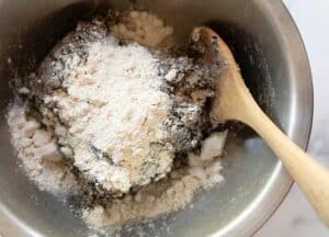 Mix in the flour and the spices to the vegan sausage mix