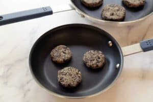 Vegan sausage being cooked in a skillet