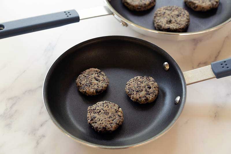 Vegan sausage being cooked in a skillet