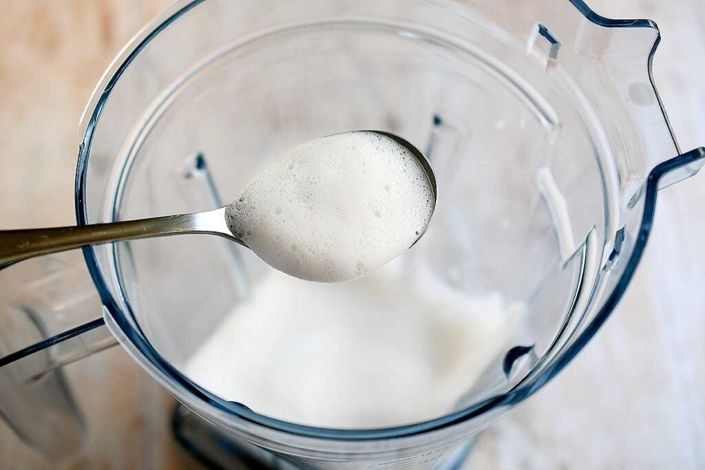 Foamed vegan milk in a Vitamix Aer pitcher