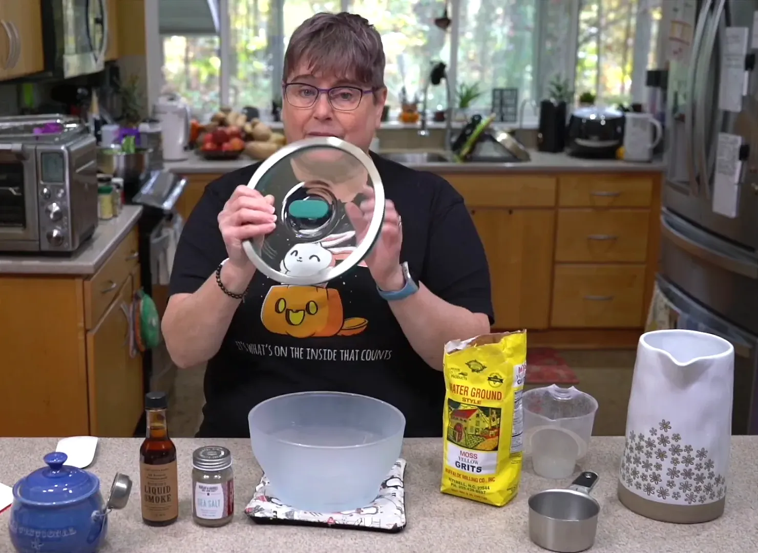 Measuring grits into the bowl.